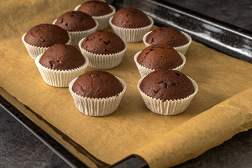 Sweet chocolate muffins with pieces of chocolate.