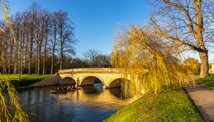 Tourists on punt trip (sightseeing with boat) along River Cam near Kings College in the city of...