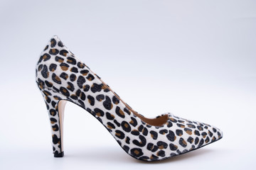 Leopar patterned shoes isolated on white background