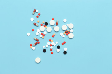 Medicine, colored  pills, capsules on blue background
