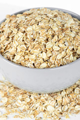 Oat flakes in bowl closeup