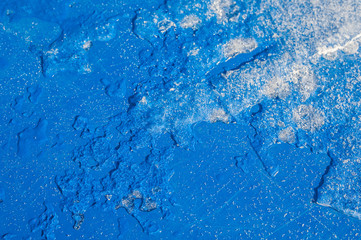 Texture of blue material with snow and ice