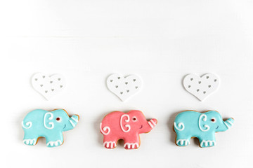 Frame for the design of a baby banner, greeting card. Background for baby banner. Children banner with elephants. Base for banner with gingerbread-elephants