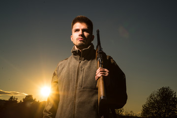 Hunting Gear and Hunting Clothing. Hunter with shotgun gun on hunt. Closed and open hunting season.