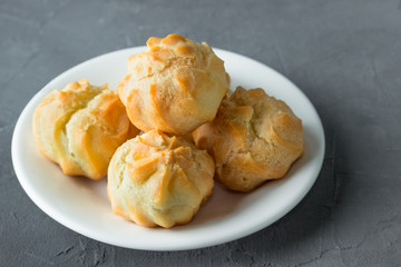 Homemade pastries: profiteroles with butter cream.