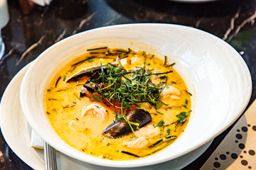 Cream soup with seafood, shrimp, mussels, langoustines, fish