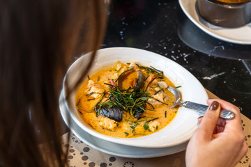 Cream soup with seafood, shrimp, mussels, langoustines, fish