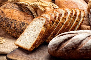 fresh baked bread on wooden background
