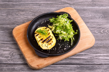 Vegetarian salad with grilled mango, fresh frisee and sesame
