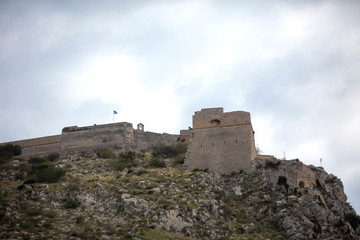 Fototapeta na wymiar Palamidi fortress on the hill, Nafplion - Greece. Walls and bastions of Palamidi fortress, Nafplio, Peloponnese, Greece - Immagine