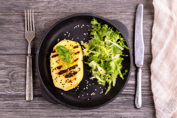 Vegetarian salad with grilled mango, fresh frisee and sesame
