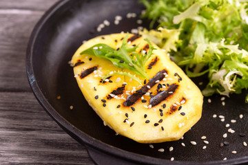 Vegetarian salad with grilled mango, fresh frisee and sesame