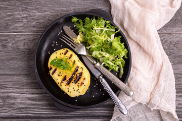 Vegetarian salad with grilled mango, fresh frisee and sesame