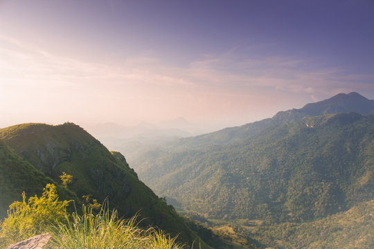 magic beautiful view from little Adams peak at Sri Lanka. Fresh nature background. High mountain with trees, blue sky.