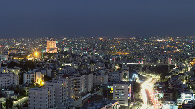 Abdoun bridge and famous 5 star hotel in Amman city at night - Aerial shot for Abdoun area and abdoun bridge