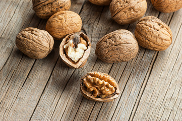 Pile whole big walnut kernel with thin shell on wooden vintage rustic backdrop. healthy food for brain. Fresh walnuts background concept 