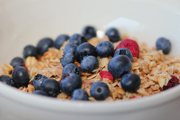 muesli bowl with blueberries and raspberries
