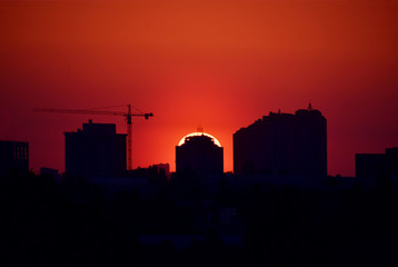 Fototapeta na wymiar Red dramatic sunset over the city.
