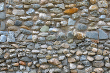 background made of a closeup of a wall with pebbles