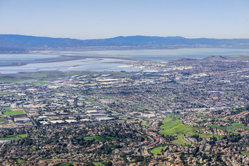 Aerial view of Fremont and Newark on the shoreline of east San Francisco bay area; Dumbarton bridge...