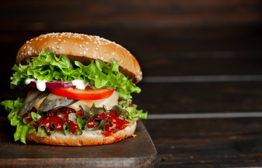 mouth-watering delicious homemade burger used to chop beef on the wooden table
