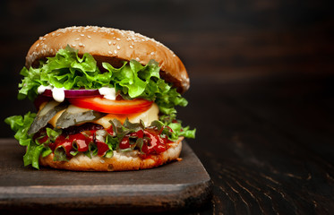 mouth-watering delicious homemade burger used to chop beef on the wooden table