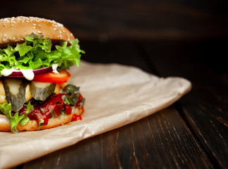 mouth-watering delicious homemade burger used to chop beef on the wooden table
