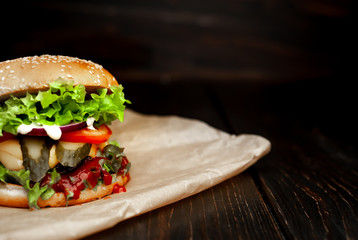 mouth-watering delicious homemade burger used to chop beef on the wooden table