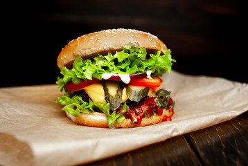mouth-watering delicious homemade burger used to chop beef on the wooden table