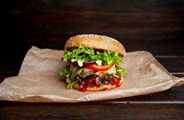 mouth-watering delicious homemade burger used to chop beef on the wooden table