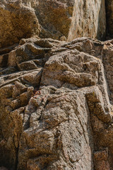 Fototapeta na wymiar texture of the natural stone background outdoors, pattern