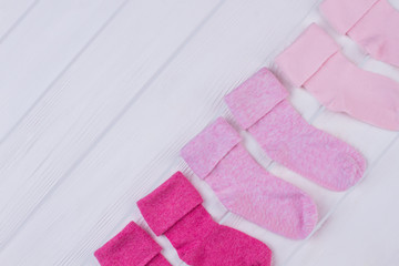 Colourful pink socks in a row.