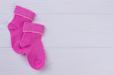 Pink wool winter socks and copyspace.