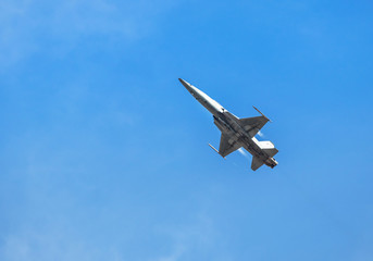 fighter jet military aircraft flying with high speed  on blue sky 