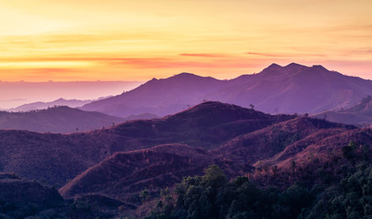 Colorful landscape view in early morning before the sunrise with misty covered mountain hills at Thong Pha Phum. Kanchanaburi, Thailand
