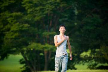 Asian male model poses for pictures on the street