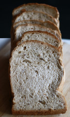 Slice white breads on the wooden board.