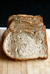 Slice white breads on the wooden board.