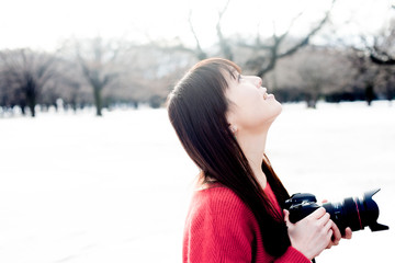 Asian female model poses for pictures on the street