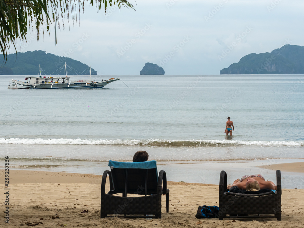 Wall mural people enjoy vacation at lio beach in el nido, palawan