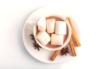 a cup of hot chocolate with marshmallow and cinnamon isolated on white.
