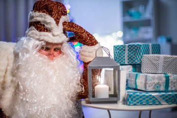 Santa Claus and his gifts. He thinks who to give gifts.