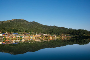The Reflection of home town in the River, Riverside view at Rak Thai Village, Mae hong son, Thailand