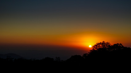 Sunset and tree silhouettes in Pico das Flores, Extrema, Brazil