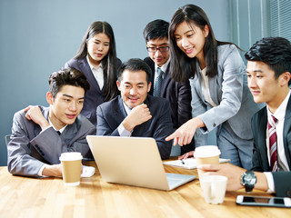 asian corporate people reviewing business results