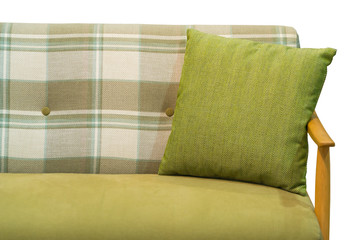 Modern green fabric pillow on luxury green checkered pattern fabric sofa interior on white background