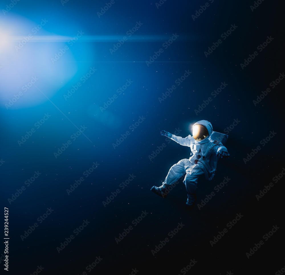 Wall mural astronaut exploring outer space