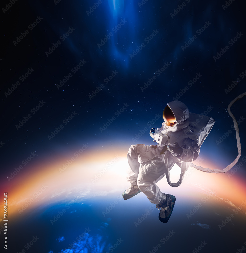 Wall mural astronaut exploring outer space