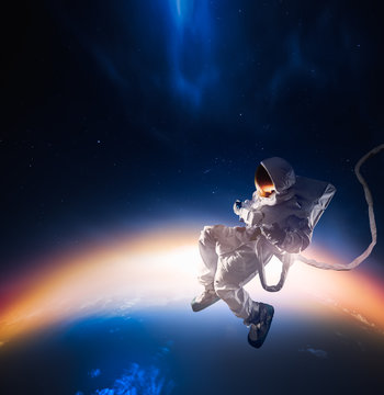 Astronaut exploring outer space © fergregory