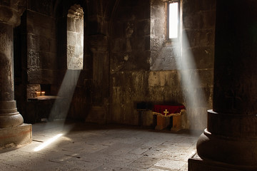 amazing light falling from the windowin the temple.Armenia. Geghard monastery